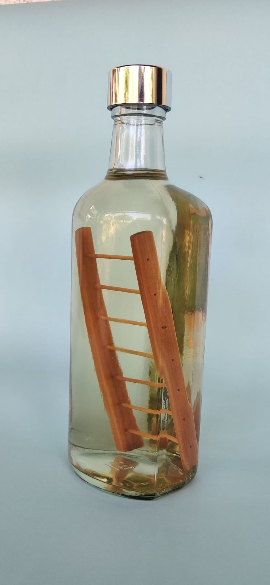 Custom made glass bottle with wooden ladder